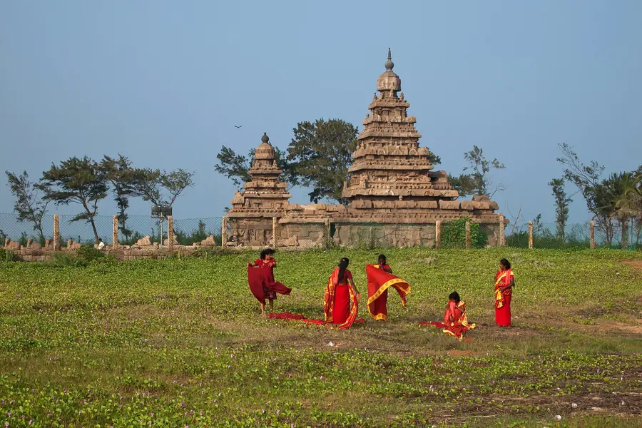 Shore Temple at Mahabalipuram with visitors on the lawn